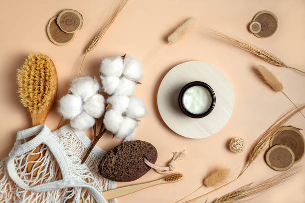 istock white cream in a round box and bath accessories on beige background 1347265873