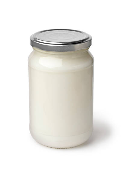 istock Single glass jar with coconut oil on white background 1347266127