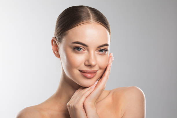 istock Beautiful Woman touch own face 1347266472