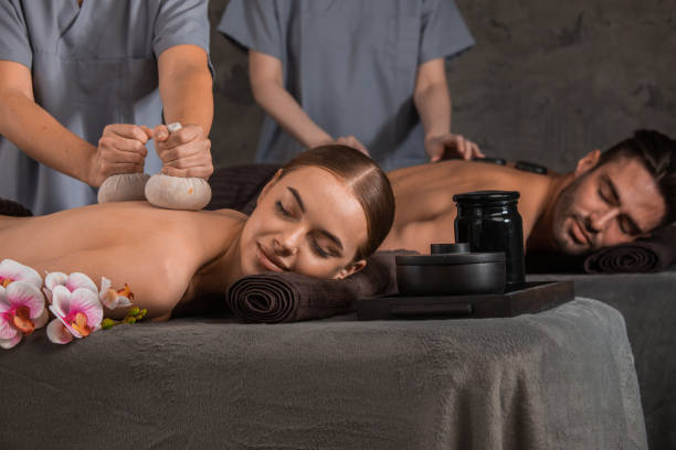 istock Couple in spa salon getting massage 1347266480