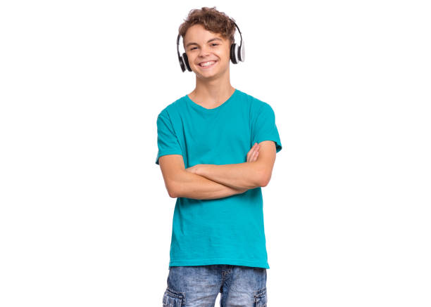 Cheerful Guy in headphones listens to music gesturing with his hands emotions. High quality photo