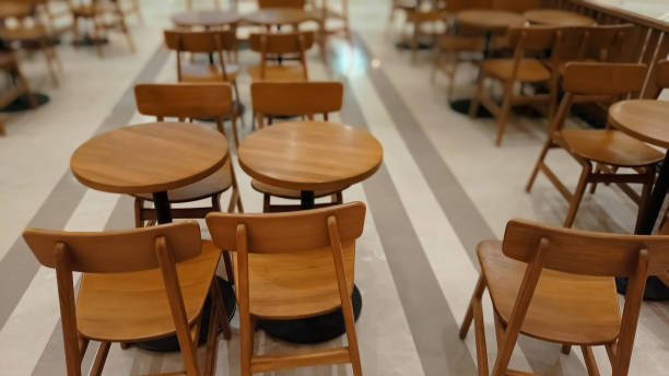 istock Tables and chairs wooden material in a row 1347268249
