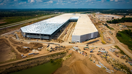 Austin , Texas , USA - September 15th 2021: The Tesla Texas Gigafactory in Austin Texas the largest and most advanced electric car factory in the world with the Final Section almost completed and ready for production