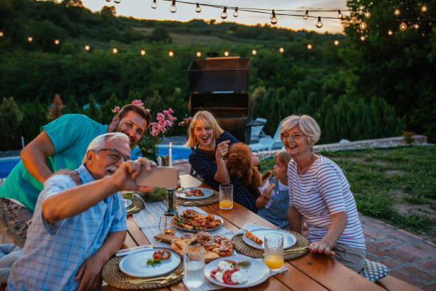 istock Family taking a selfie during dinner in the backyard 1347271844