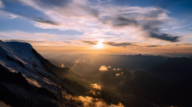istock Majestic sharp peak. Snowy mountain landscape against sunset sky 1347272717