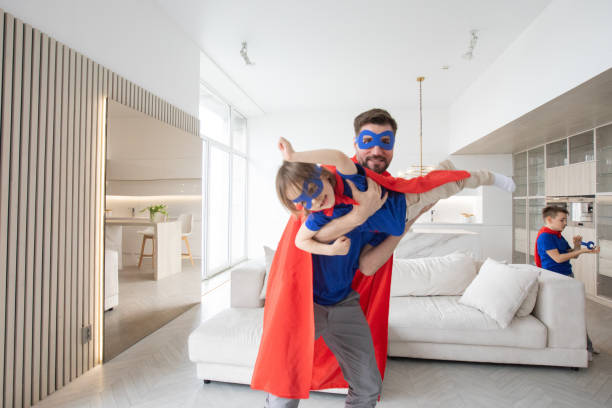istock Father and son play superhero 1347273189