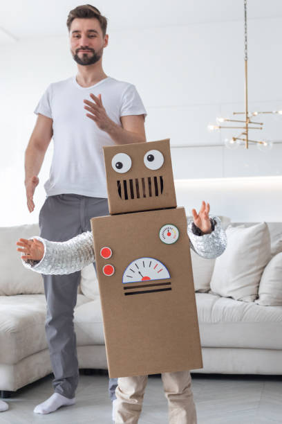 istock Father and son playing at home 1347273222