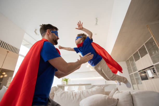 istock Father and son play superhero 1347273603