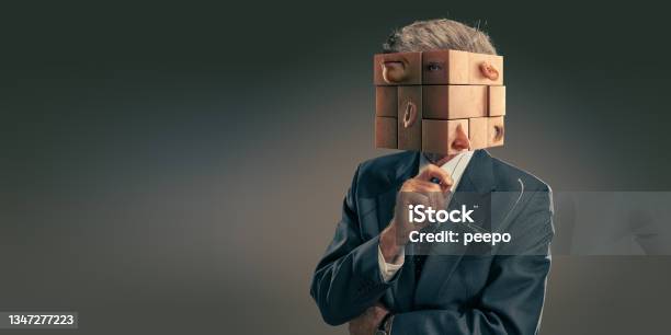 Portrait Of Business Man In Suit With Head As Scrambled Puzzle Pieces Stock Photo - Download Image Now