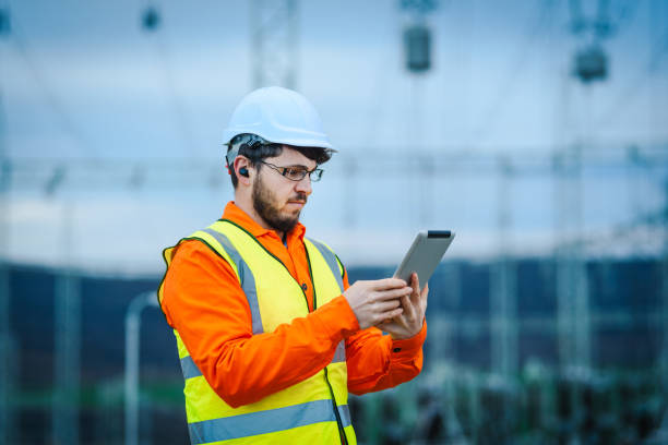 istock Electrical engineer working in front of Electricity power station 1347277378