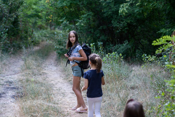 istock Kids hiking in the forest 1347277517