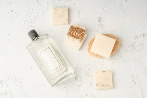 istock natural soap bars and bottle of cologne with blank white label on table 1347279108