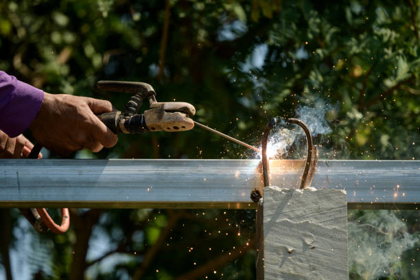 istock Welder is welding metal part in construction site 1347280391