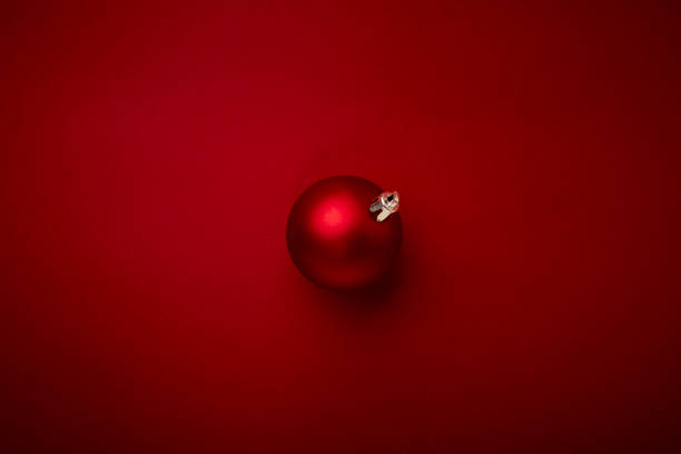 istock Red Christmas ball decoration on red background 1347280394