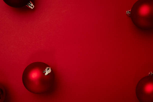 istock Red Christmas ball decoration on red background 1347280405