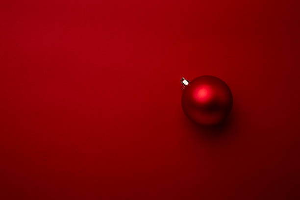 istock Red Christmas ball decoration on red background 1347280419