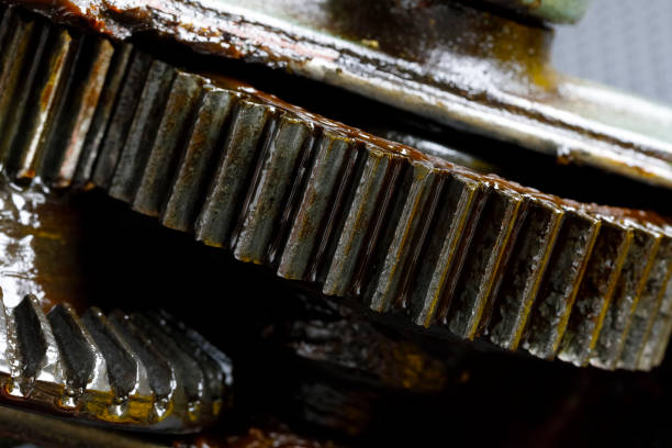 This is a view of the transmission mechanism from the crank to the chuck of an old hand drill. Worn grease can be seen on the cog wheels of this unit.