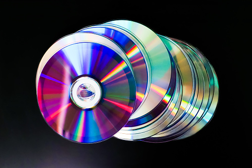 Multi-colored compact disc on white background is insulated