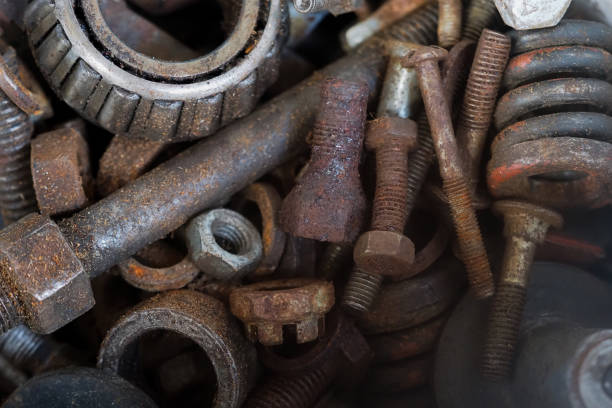 istock Old and rusty nuts and screws, spring, bearing in a car workshop. Rusted abstract metal background 1347283943