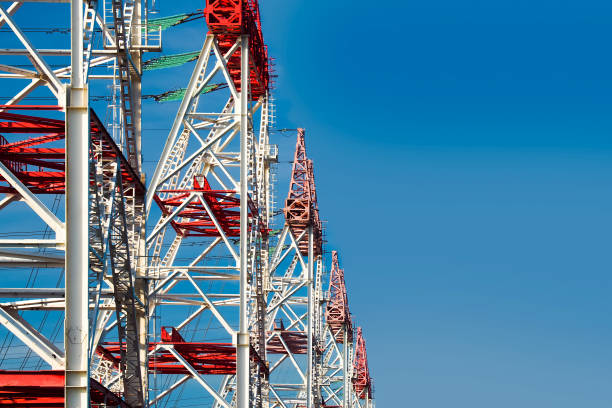 istock Substation, high voltage transmission tower. Distribution substation with power lines and transformers. High voltage power wires on blue sky background, copy space. Electricity 1347284185