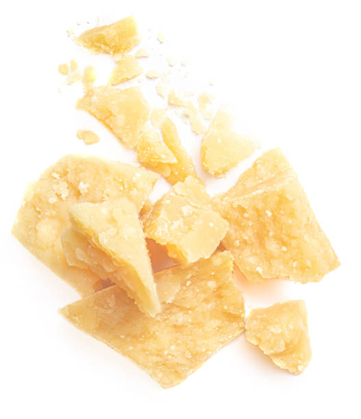 istock Parmesan cheese (Parmigiano, Grana)  isolated on white background.  Hard mature cheese, pile, top view.