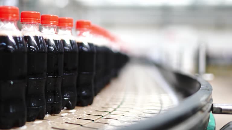 Production line of carbonated drinks on conveyor belt