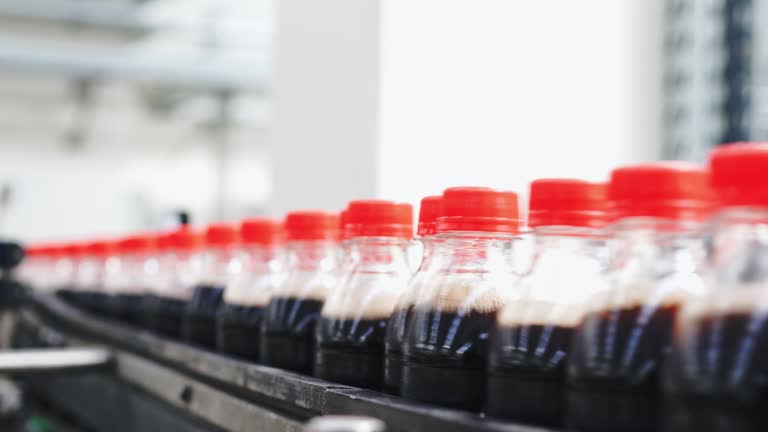 Production line of carbonated drinks on conveyor belt