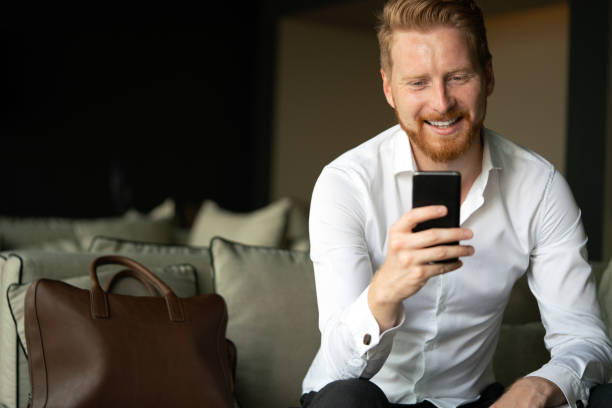 istock Handsome young businessman on a phone in the office 1347287745