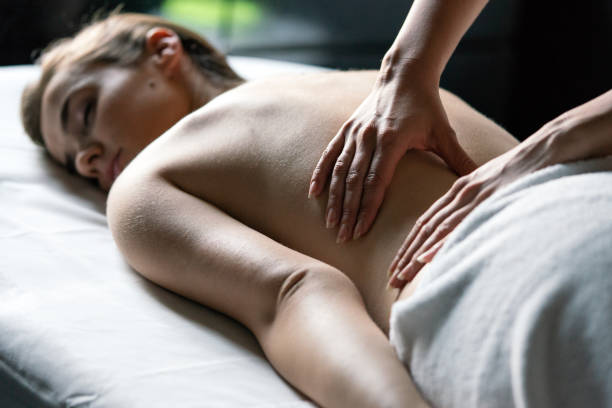 istock Young beautiful female in beauty salon getting spa massage 1347287867