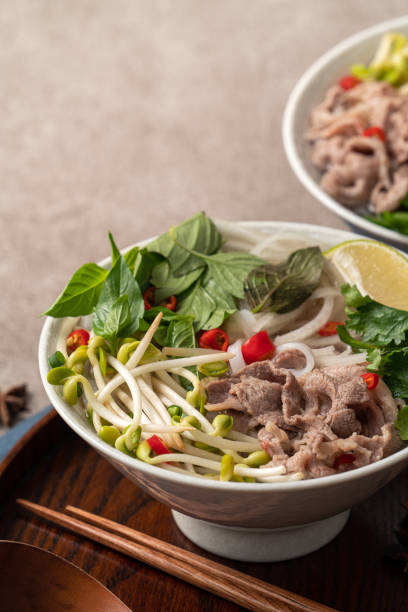 istock Delicious vietnamese beef noodles pho with ingredients. 1347290607