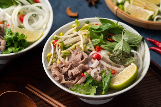 istock Delicious vietnamese beef noodles pho with ingredients. 1347290624