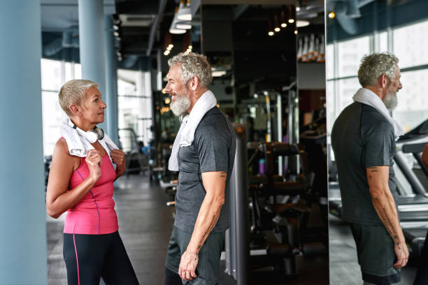 istock Affectionate mature couple during first meeting in gym 1347290878