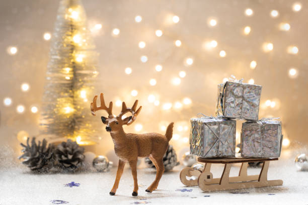 Deer and sleigh with Christmas gifts.