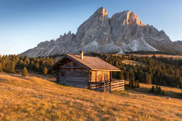 Alpine landscape - wooden cabin circled by trees in Dolomite mountains, Southern Tyrol area. Popular travel destination.
Fantastic view of Peitlerkofel mountain from Passo delle Erbe in Dolomites