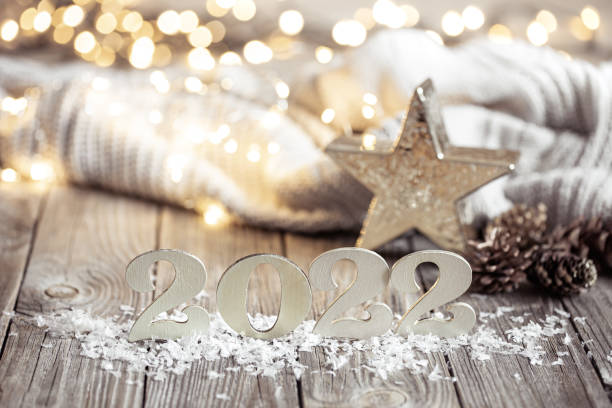 istock Cozy festive composition with the numbers 2022 and decor details close up. 1347292532