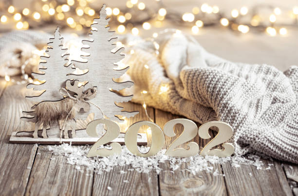 istock Cozy festive composition with the numbers 2022 and decor details close up. 1347292545