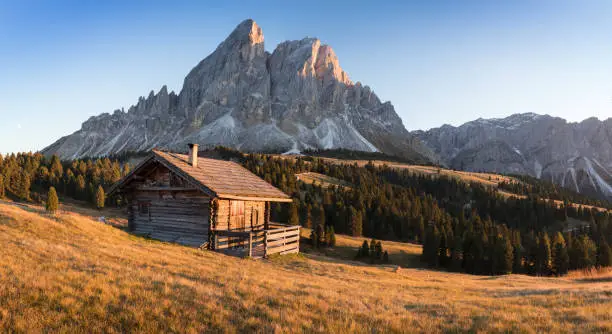 Alpine landscape - wooden cabin circled by trees in Dolomite mountains, Southern Tyrol area. Popular travel destination.
Fantastic view of Peitlerkofel mountain from Passo delle Erbe in Dolomites