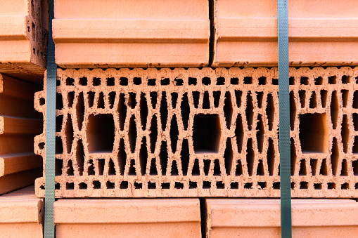 Ceramic bricks in the construction market on the street, close up