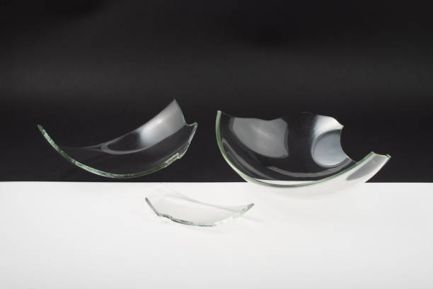 istock Broken glass pieces on black and white background. 1347292596