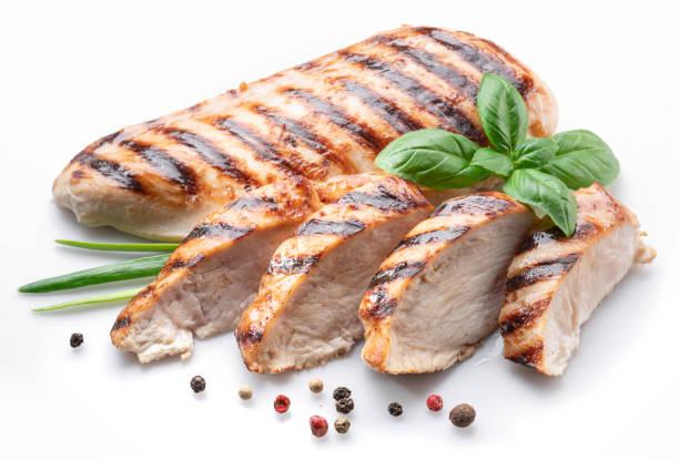 istock Grilled chicken fillet with herbs isolated on white background. 1347292604