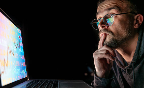 istock A man analyzing stock market charts, financial data on an electronic board. 1347293092