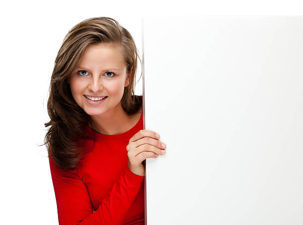 istock Young beautiful woman holding white board 134729485