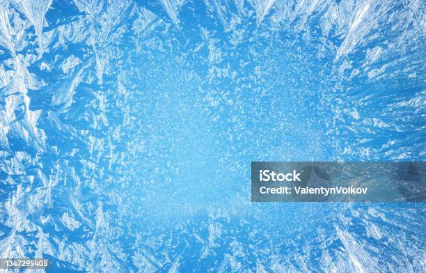 Frosty Patterns On The Edge Of A Frozen Window Stock Photo - Download Image Now - Ice, Frost, Frozen