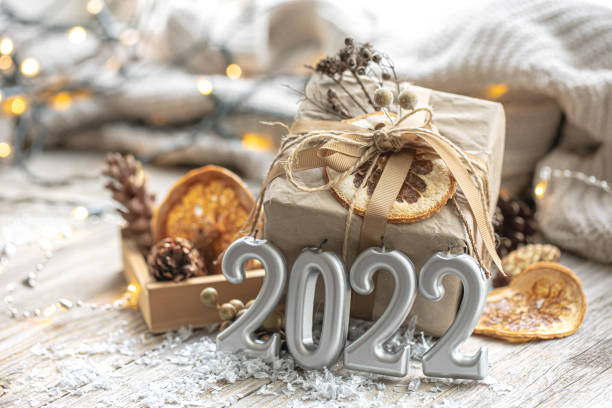 istock Festive background with Christmas present and 2022 numbers. 1347297724
