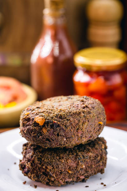 istock alternative burger made from black beans, vegetables, beets, wholemeal flour and quinoa, with various vegetables. 1347298559