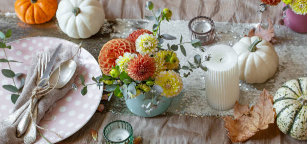 istock Festive table setting with pumpkins, candles and chrysanthemum flowers. 1347300985