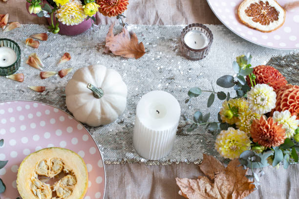 istock Festive table setting with pumpkins, candles and chrysanthemum flowers. 1347300990