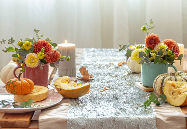 istock Festive table setting with pumpkins and chrysanthemum flowers. 1347300993