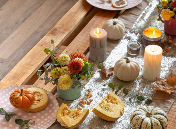 istock Festive table setting with pumpkins and chrysanthemum flowers. 1347300995