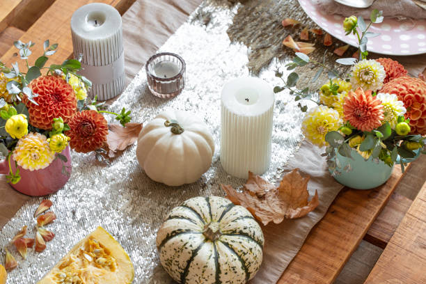 istock Festive table setting with pumpkins, candles and chrysanthemum flowers. 1347301000